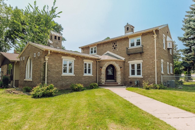 view of front of property featuring central air condition unit and a front lawn