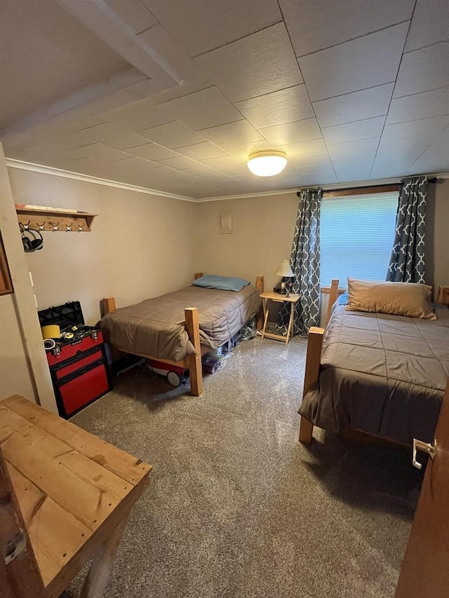 carpeted bedroom with ornamental molding