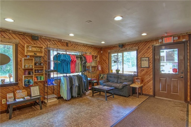 interior space featuring a wealth of natural light and wooden walls