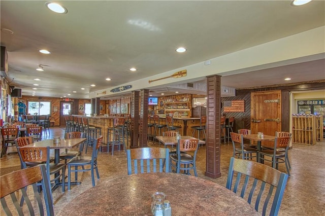 dining space featuring bar area