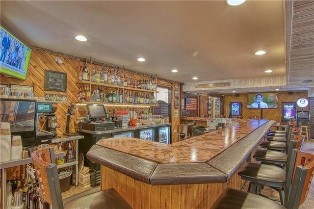 bar featuring wood walls