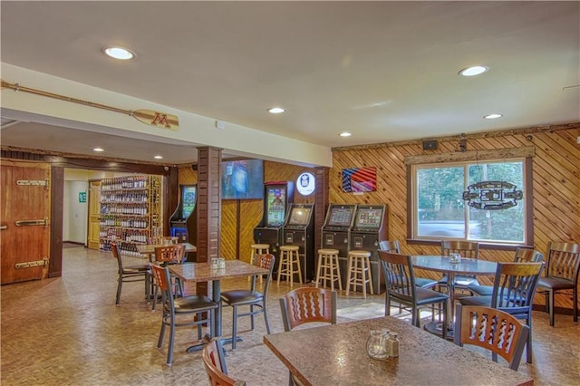 dining space with wooden walls