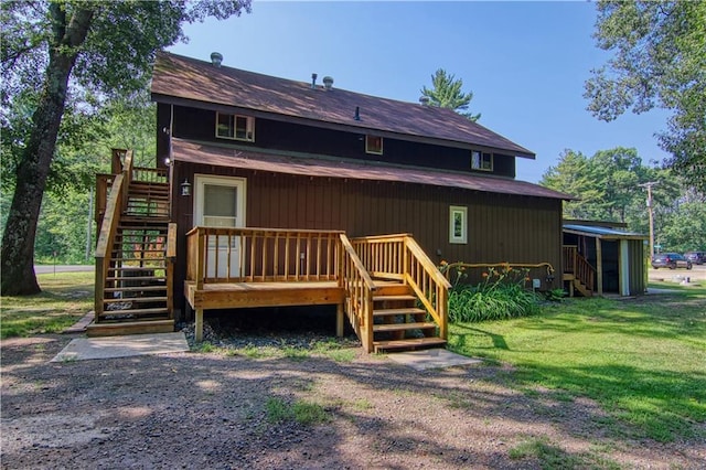 rear view of house with a lawn