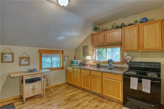 kitchen featuring light hardwood / wood-style flooring, black electric range oven, and lofted ceiling