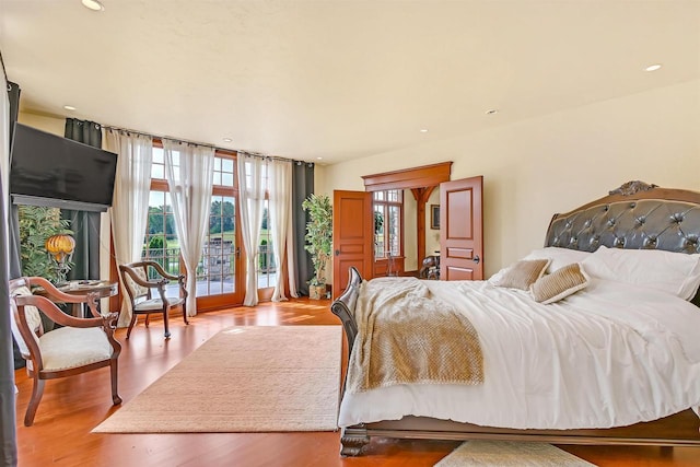 bedroom featuring access to outside and light wood-type flooring