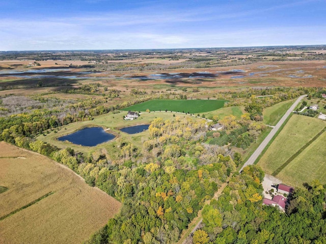 birds eye view of property featuring a rural view and a water view