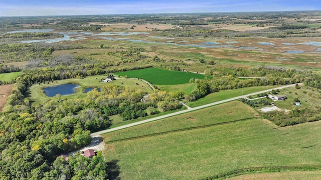 birds eye view of property featuring a rural view and a water view