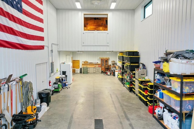 garage featuring wood walls