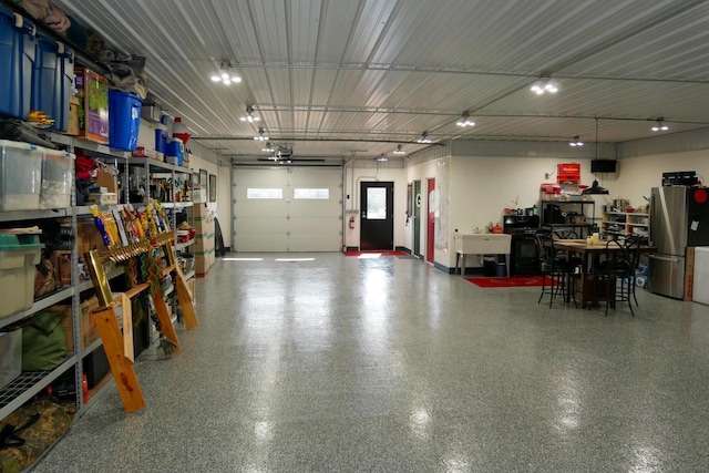 garage featuring stainless steel refrigerator