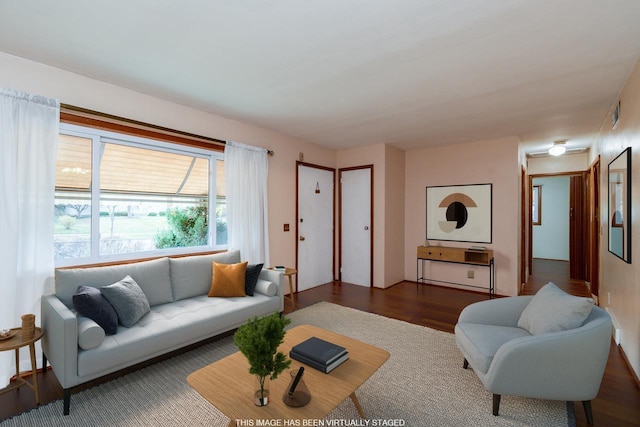 living room with dark hardwood / wood-style floors