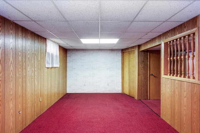 spare room featuring wooden walls