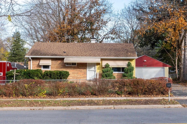 view of front of house featuring an outbuilding and a garage