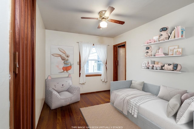 bedroom with dark hardwood / wood-style flooring and ceiling fan