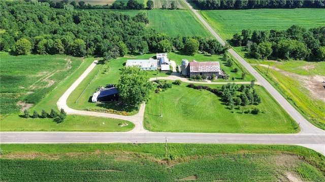 birds eye view of property with a rural view