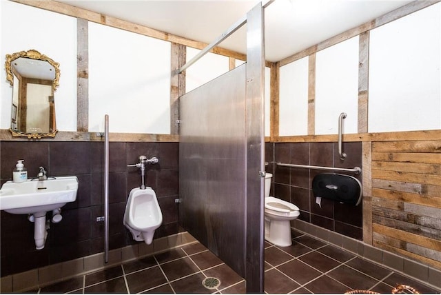 bathroom featuring sink, tile walls, toilet, and tile patterned flooring