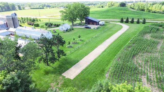 birds eye view of property with a rural view