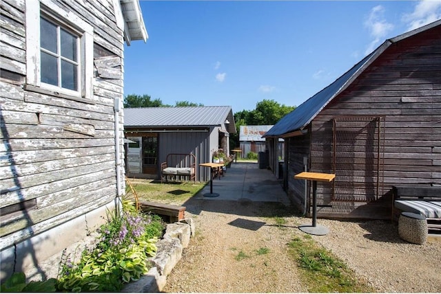 view of side of property with a patio area