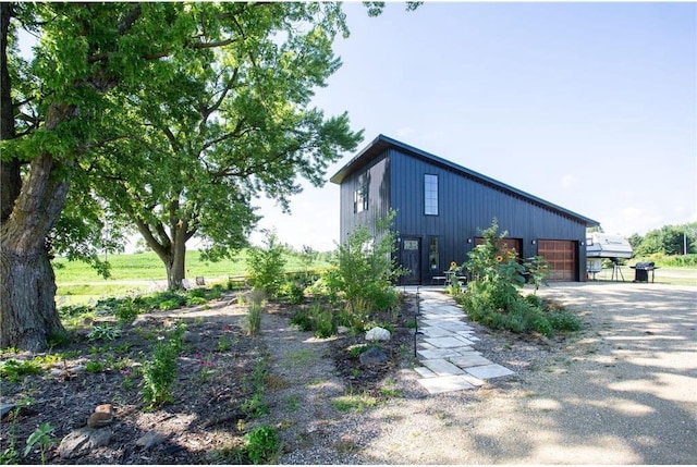 view of side of property featuring a garage