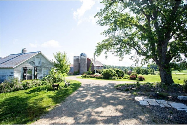 view of home's community featuring a lawn