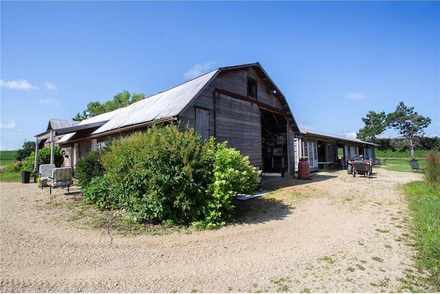 view of side of property featuring an outbuilding