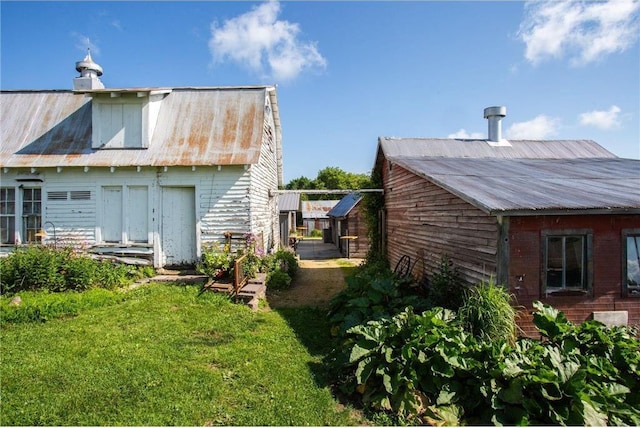 view of home's exterior with a yard