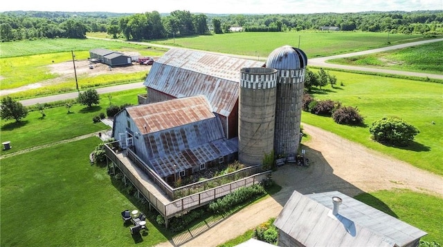 birds eye view of property with a rural view