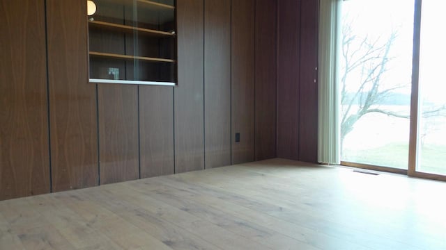 unfurnished room featuring light wood-type flooring