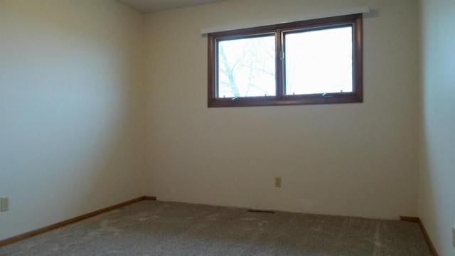 unfurnished room featuring carpet floors