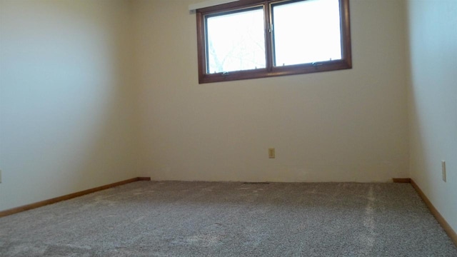 empty room featuring carpet flooring