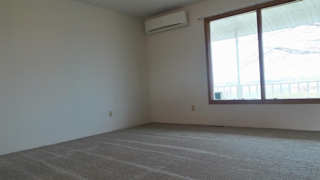 empty room with an AC wall unit, carpet floors, and a healthy amount of sunlight