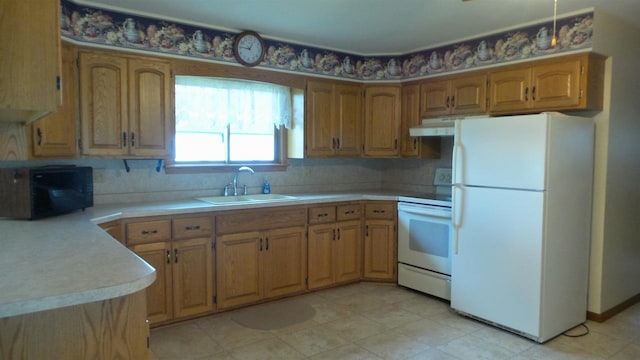 kitchen with white appliances and sink