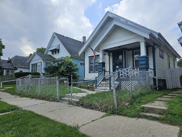 view of front of property with a front lawn and a porch