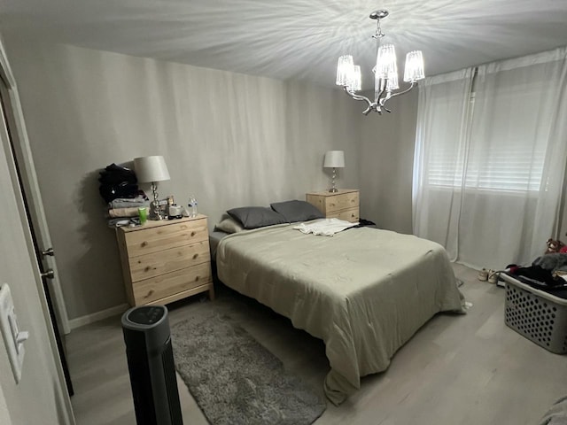 bedroom featuring an inviting chandelier