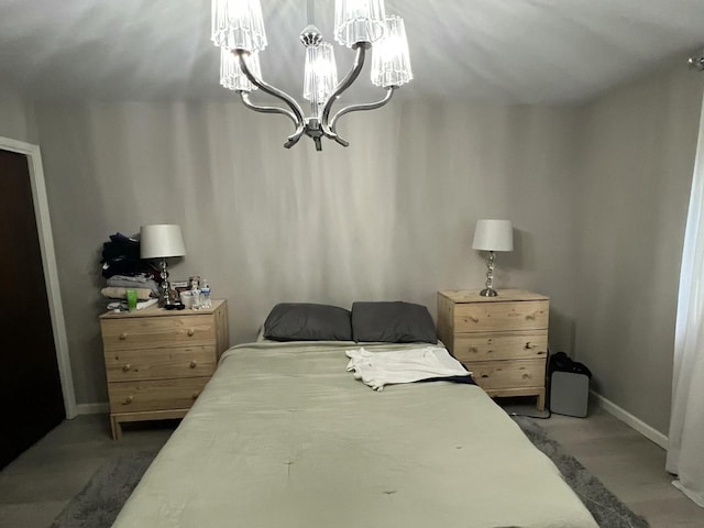 bedroom featuring a notable chandelier