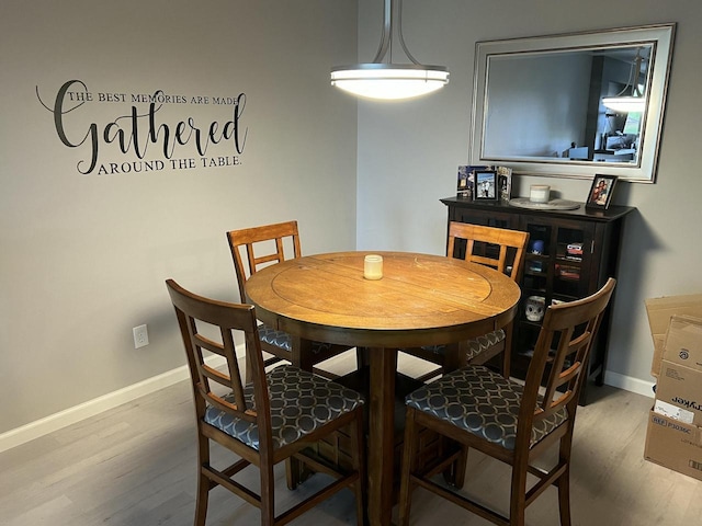 dining space featuring hardwood / wood-style floors