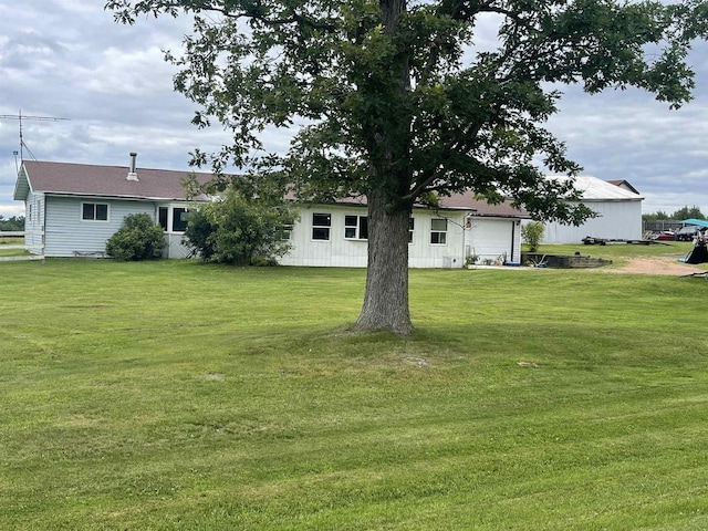 view of yard with a garage