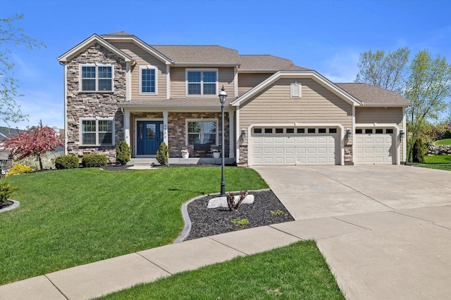 view of front of home with a garage and a front lawn