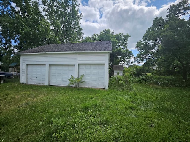 garage with a yard