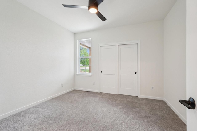 502 Hickory Hollow Rd Unit 0101, Waterford, WI 53185 - unfurnished bedroom featuring carpet floors, baseboards, and a closet