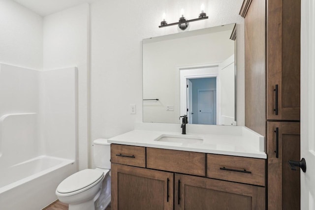 502 Hickory Hollow Rd Unit 0101, Waterford, WI 53185 - full bathroom featuring toilet, vanity, and bathing tub / shower combination
