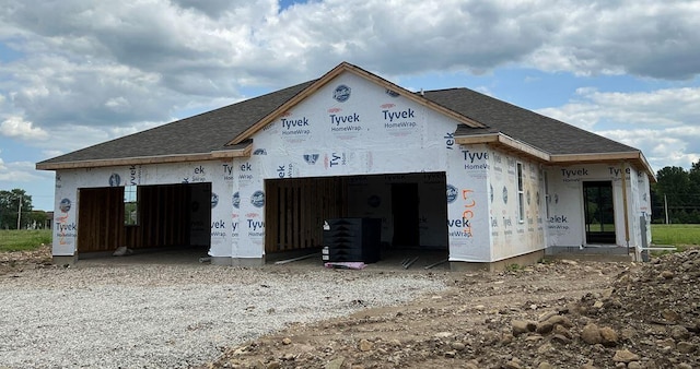 exterior space with gravel driveway