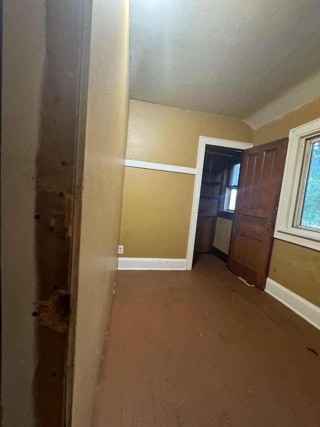 unfurnished bedroom featuring vaulted ceiling