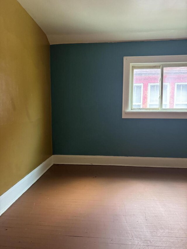 empty room featuring wood-type flooring