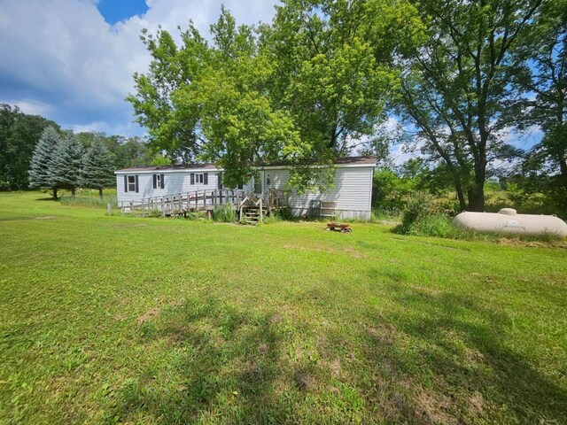 view of yard with a wooden deck