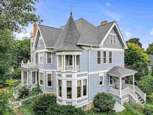 exterior space featuring a porch and a balcony