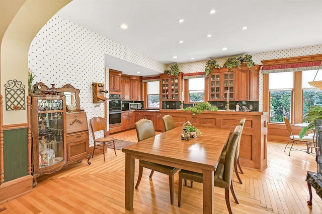 dining space featuring light parquet flooring