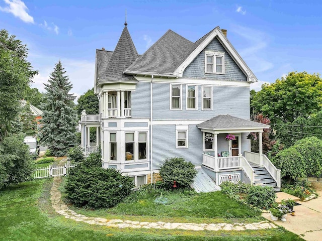 victorian house with covered porch and a balcony