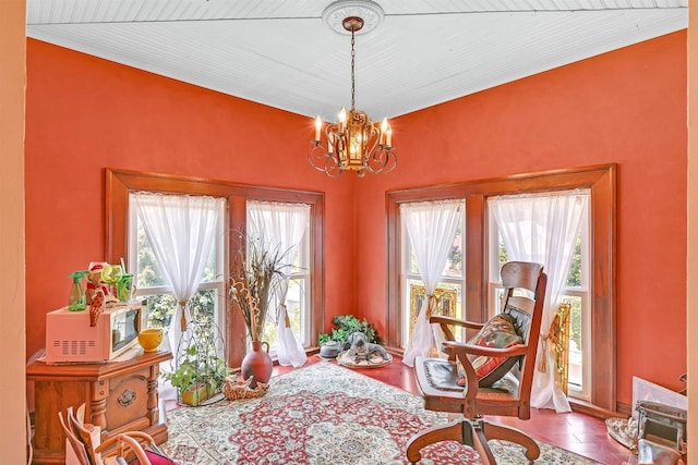 living area featuring tile patterned floors and an inviting chandelier