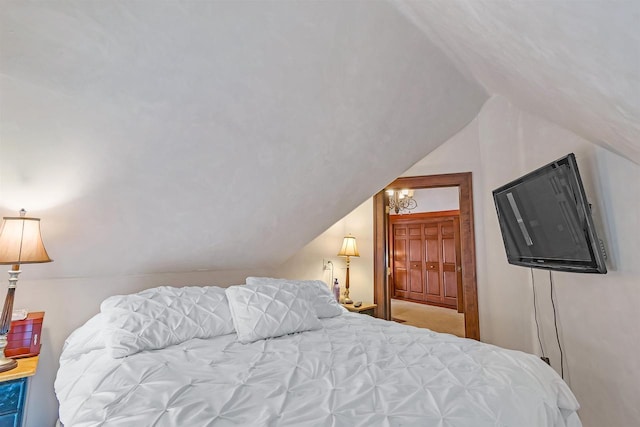 bedroom with lofted ceiling