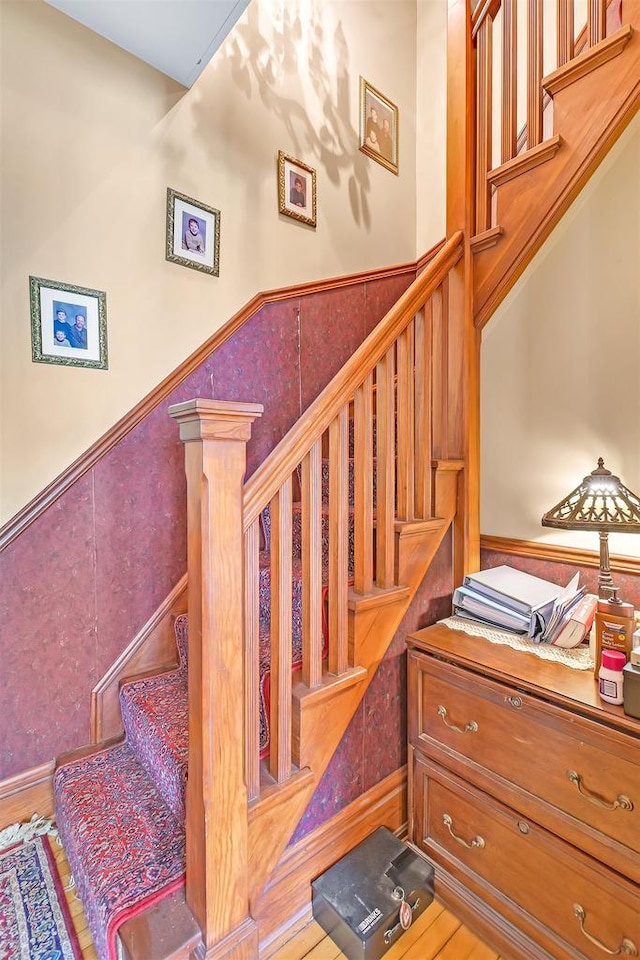 staircase with wood-type flooring